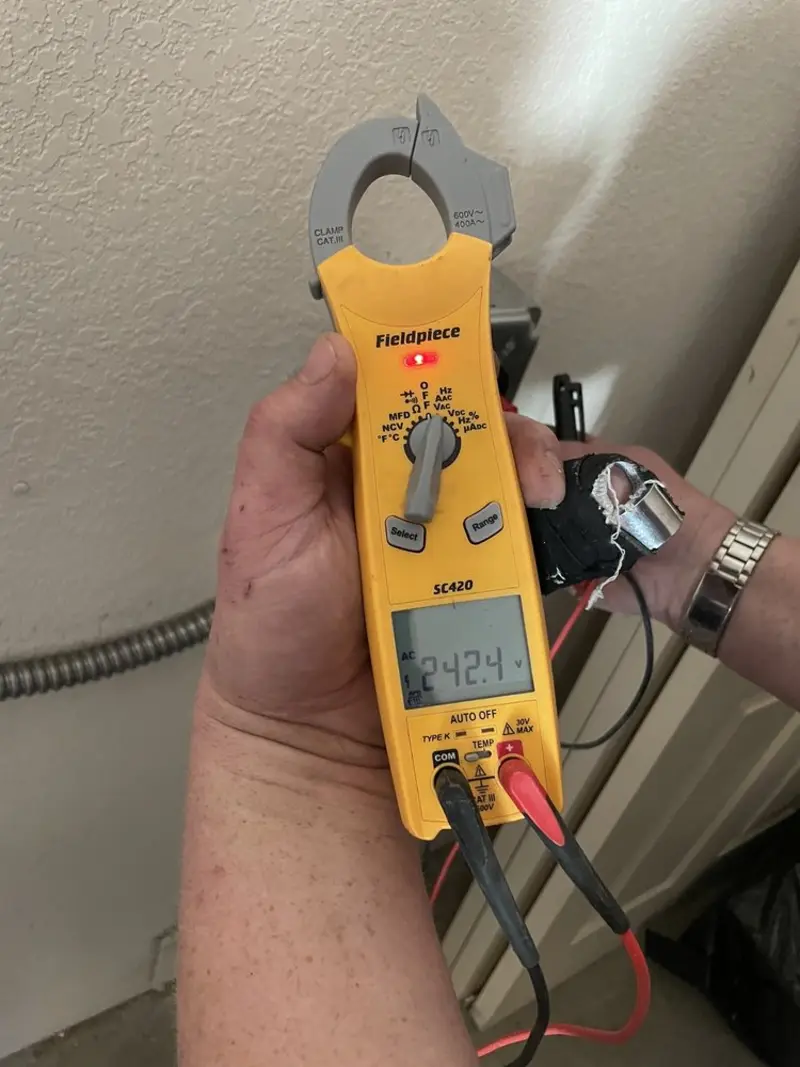 Voltage testing with clamp meter during Ceiling Fan Installation in Indiantown